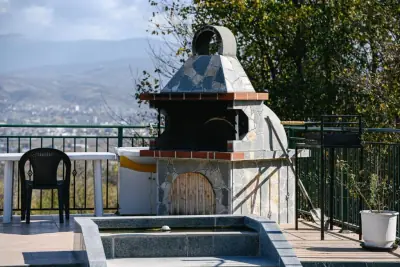 Outdoor stone BBQ oven with mountain view