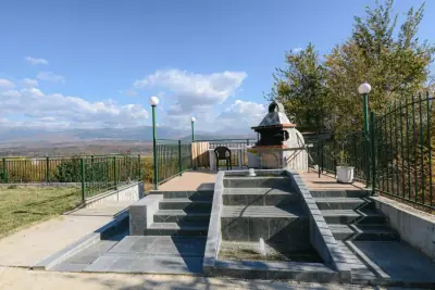 Terrace with stone fountain, BBQ and mountain views