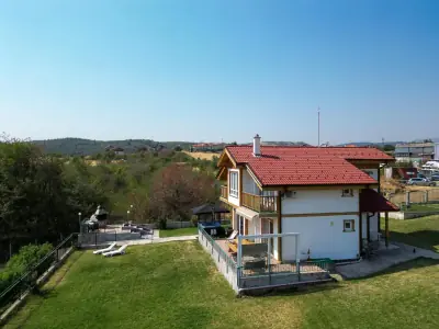 Aerial view of villa with garden, jacuzzi and terrace